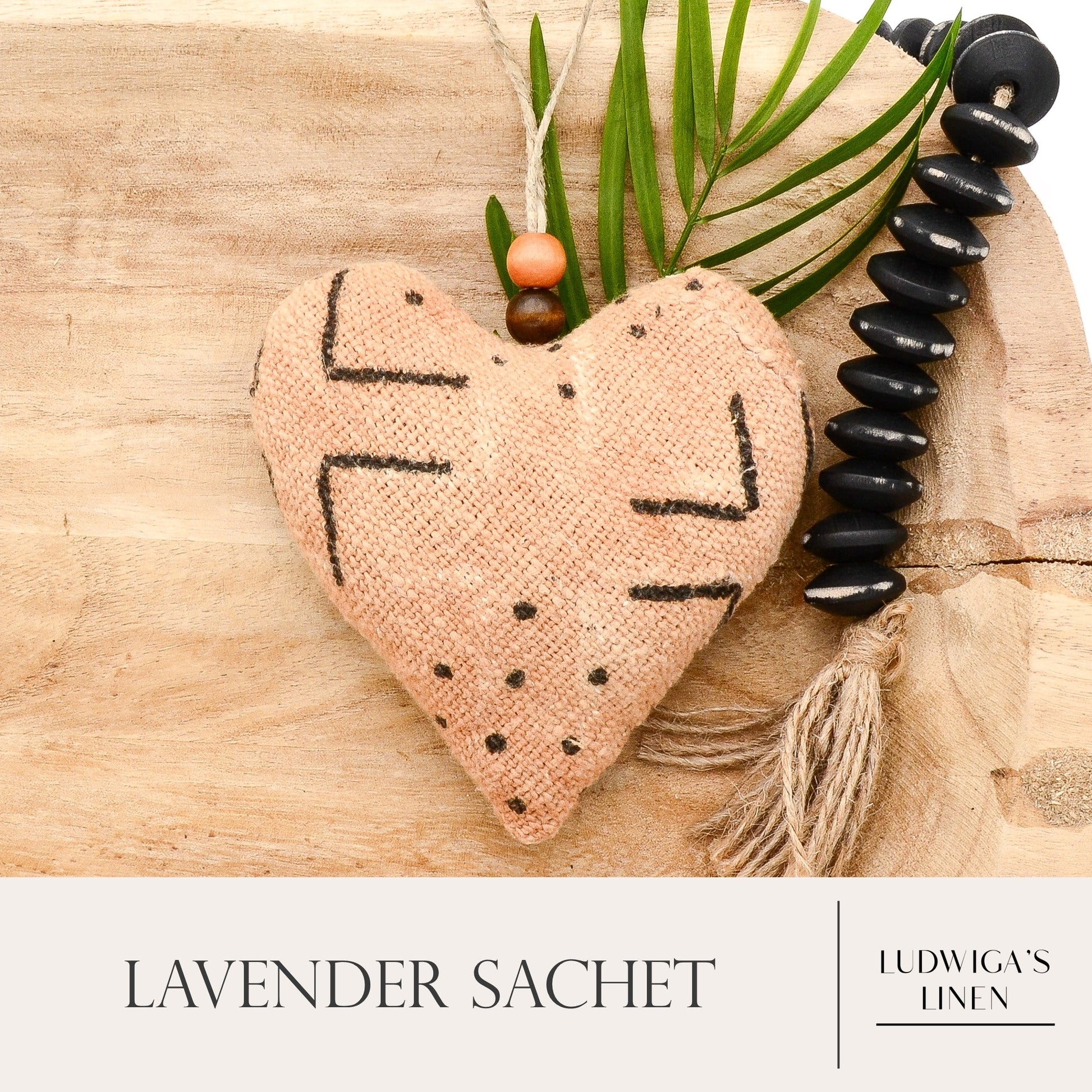 Lavender sachet heart made from handwoven African Mudcloth cotton, hemp twine tie with wooden beads, and filled with high quality lavender from Provence France