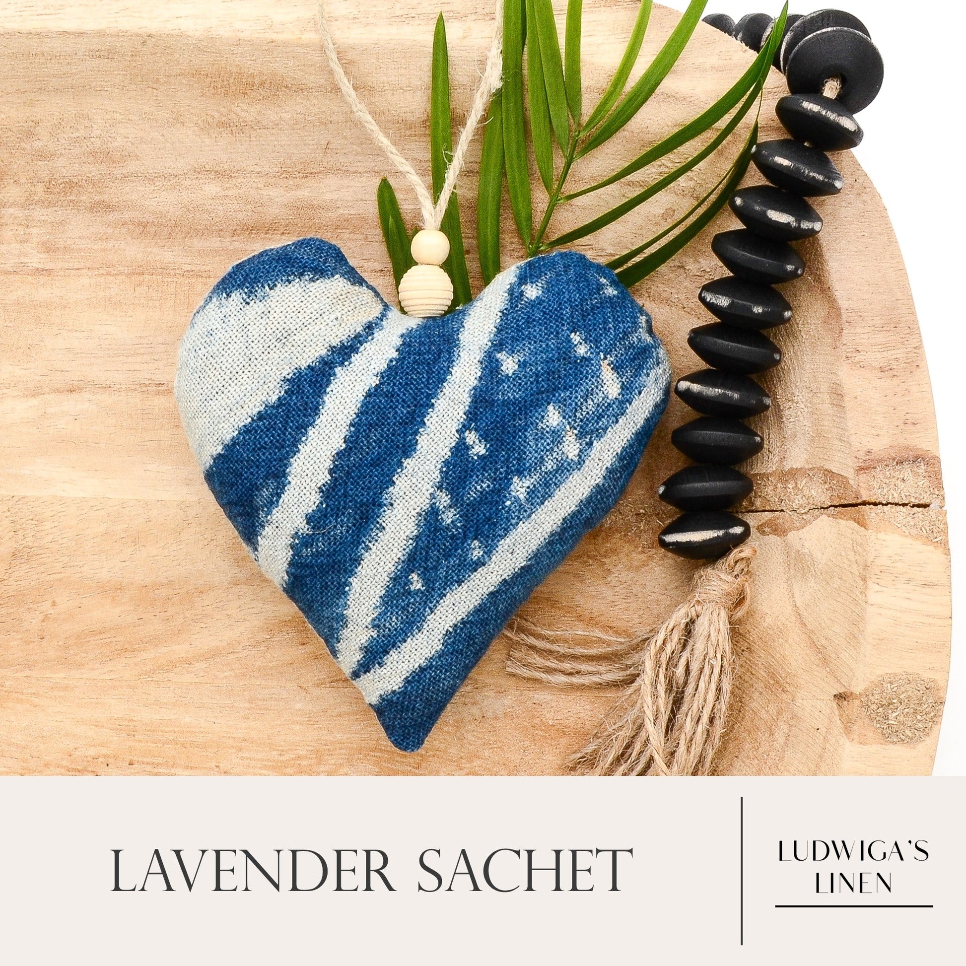 Lavender sachet heart made from handwoven African Ndop cotton, hemp twine tie with wooden beads, and filled with high quality lavender from Provence France